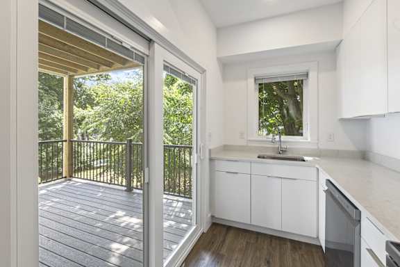 A kitchen with a sink and a window.