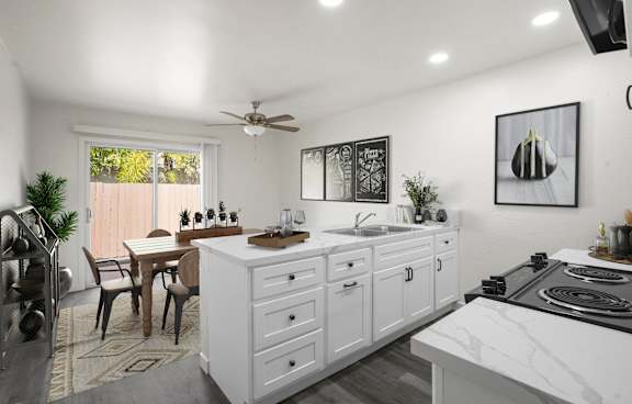 A modern living room with a grey rug and a grey sofa.