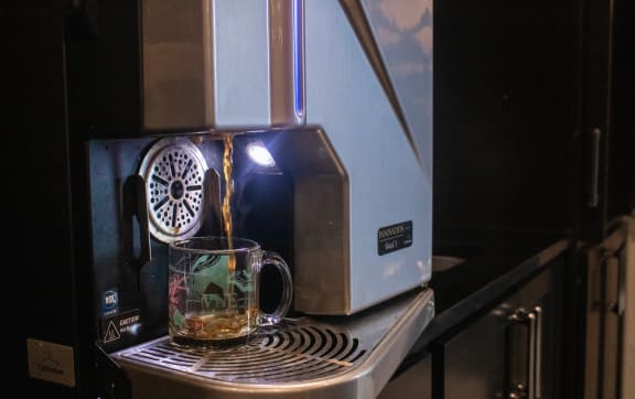 a coffee mug sitting on top of an espresso machine at Vue at Bluestone, Duluth, Minnesota