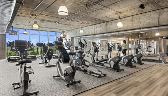 Modern gym featuring  facilities and a large workout space at Allure Herman in Houston, Tx