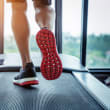 a woman running on a treadmill
