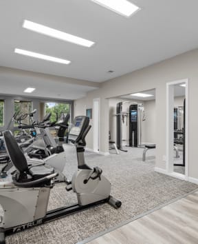 the gym at the whispering winds apartments in pearland, tx at Millcreek Woods Apartments, Olathe, KS