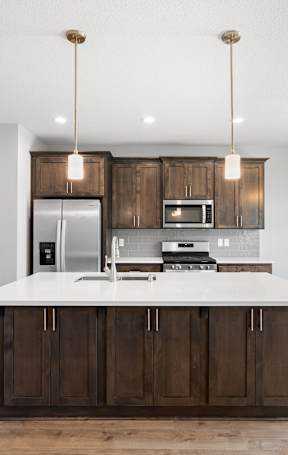 a kitchen with a large island in the middle of it