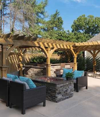 A patio with a fire pit and seating area. at Westbury Creek, Augusta