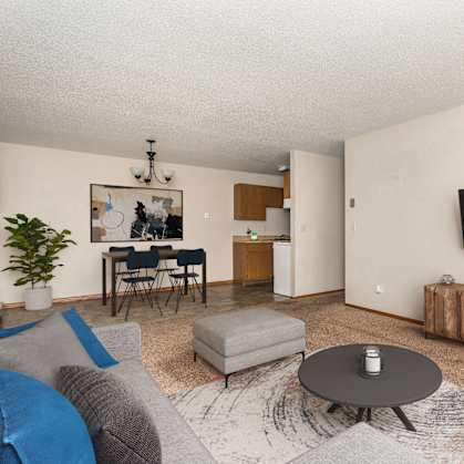 a living room with a couch and a table and a tv