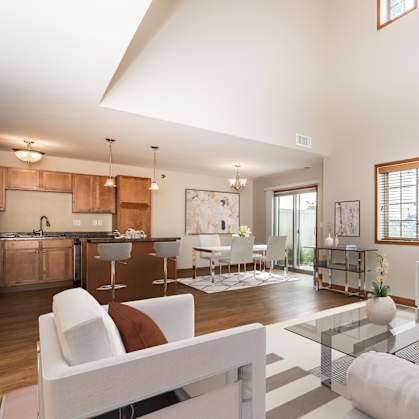 Grand Forks, ND Sterling Pointe Apartments. a living room with white couches and chairs and a glass coffee table  at Sterling Pointe, Grand Forks, 58201