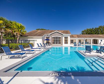 A large swimming pool with a 3 ft depth sign.