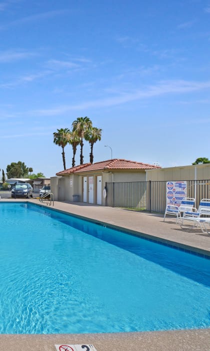 Belaire Manor's extra large pool features an assortment of pool furniture, pool bathrooms, and an outdoor shower.