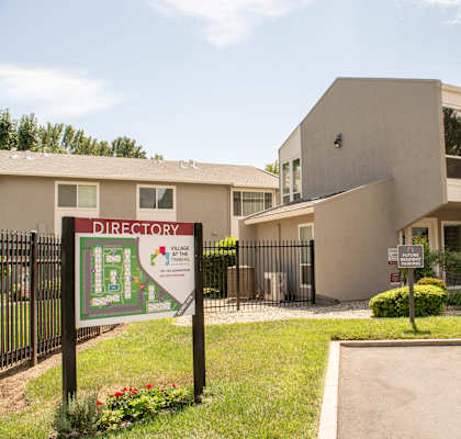 a building with a directory sign in front of it