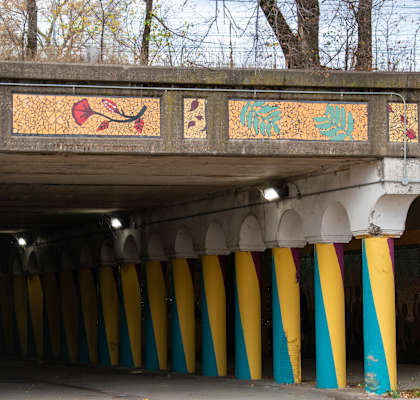 A bridge with a yellow and blue striped pillar.