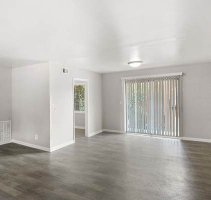 A room with a grey floor and white walls.