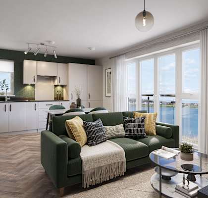 A living room with a green couch and a coffee table.