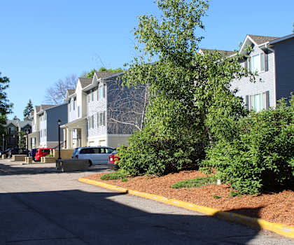 a row of houses on the side of a street