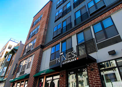 The Nines City Place is a multi-story building with a black and white facade at The Nines Apartment Homes Apartments, Allentown, PA, 18101