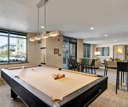 our apartments have a game room with a pool table and a bar