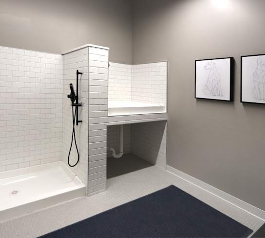 a white tiled bathroom with a shower and a sink