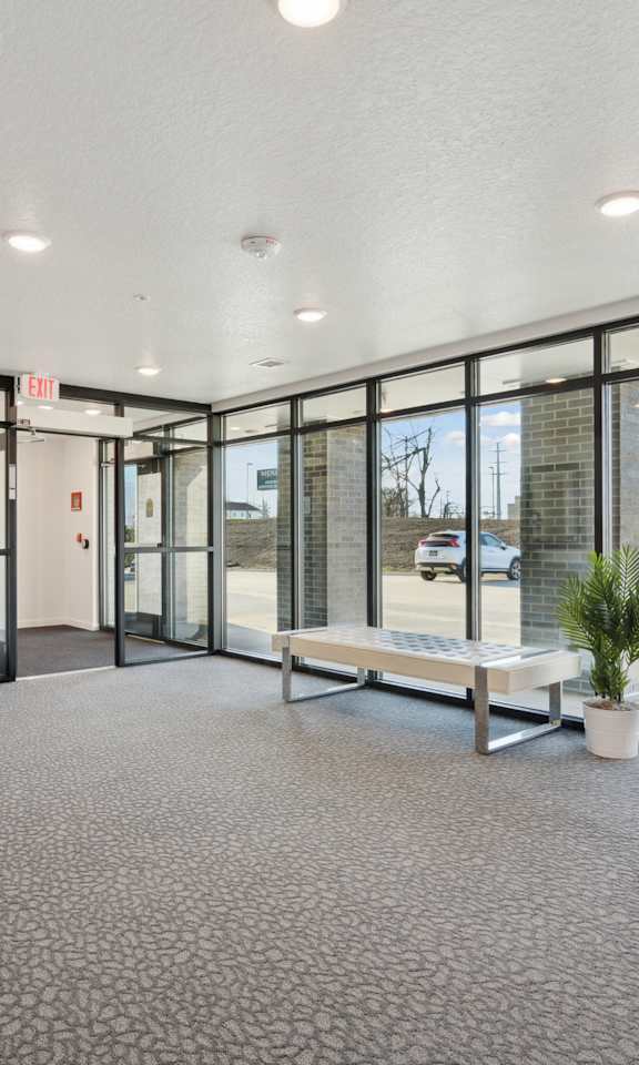 the preserve at ballantyne commons community room with windows and a bench