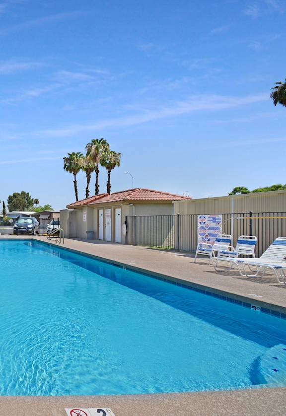 Belaire Manor's extra large pool features an assortment of pool furniture, pool bathrooms, and an outdoor shower.