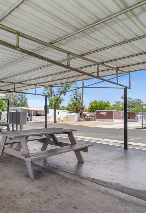 Ramada area with picnic tables and mailboxes
