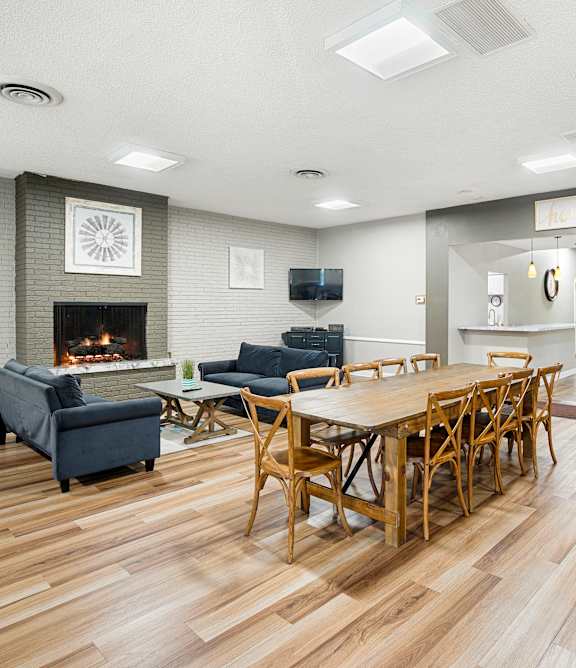 an empty room with white walls and wood floors