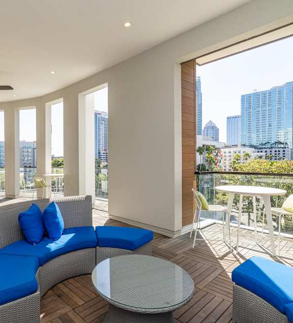 A modern living room with a view of the city.