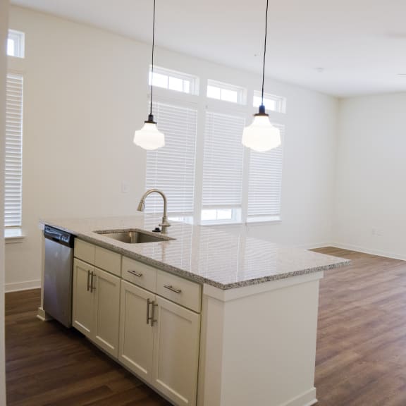 an empty kitchen and living room in an apartment