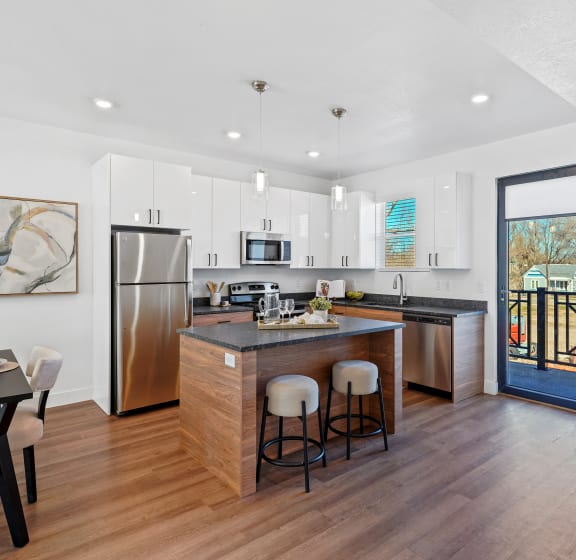 Open kitchen with stainless steel refrigerator at Current by Lotus, Ogden, UT, Utah , 84401