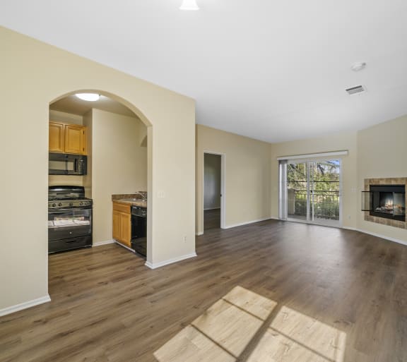 a living room with hardwood floors and a fireplace at The Village Apartments, Van Nuys, 91406