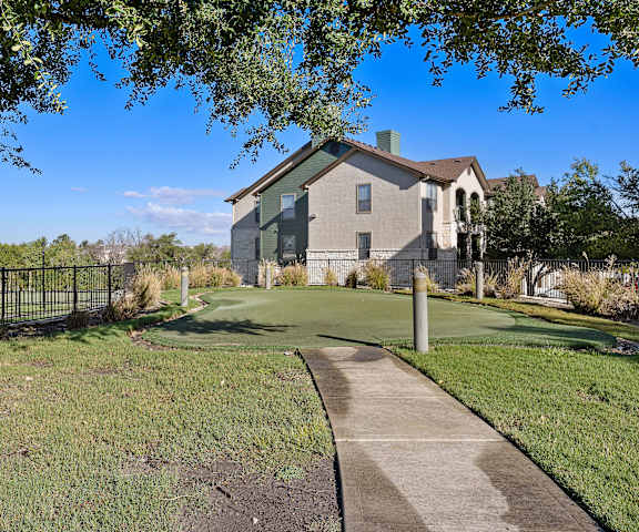 a golf course in front of a house at The Fairways at Star Ranch, Hutto