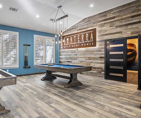 a game room with a pool table and a billiards at Sonterra Apartment Homes, Texas