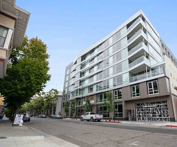 an apartment building on the corner of a street