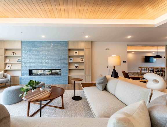 a living room with a couch and a fireplace