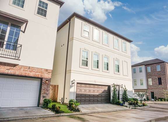 a house with a garage in front of it