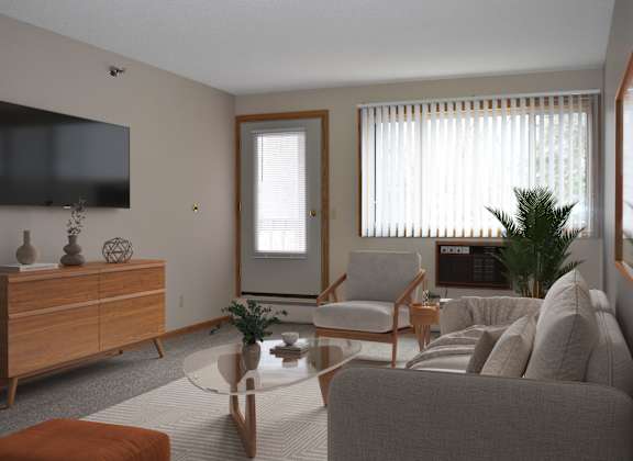 A living room with a grey couch, a wooden cabinet, a television, and a window with blinds.