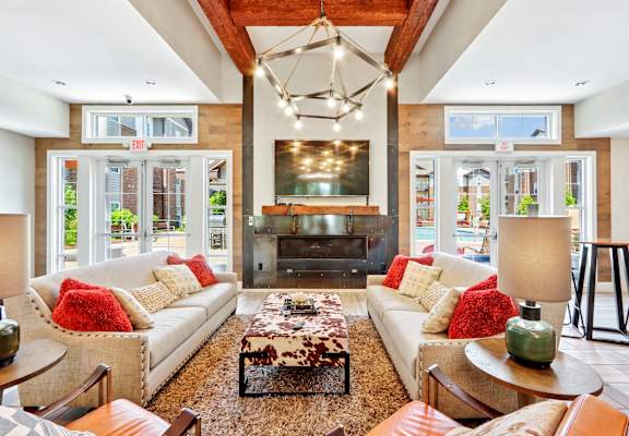 A living room with a white couch and a coffee table.