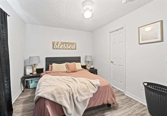 a bedroom with a bed and a closet