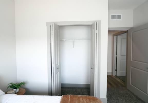 A white door is open to a hallway.