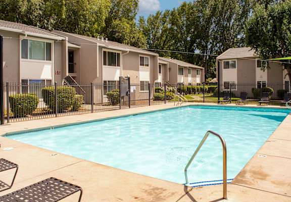our apartments have a swimming pool with a fence around it