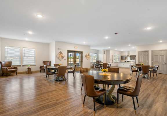the preserve at ballantyne commons community room with tables and chairs at 41 North Apartments, Fort Wayne