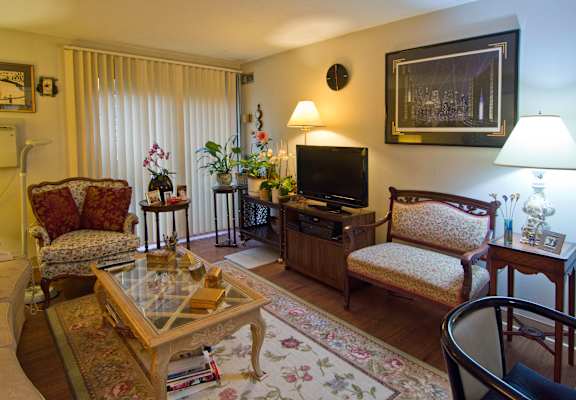 a living room filled with furniture and a television