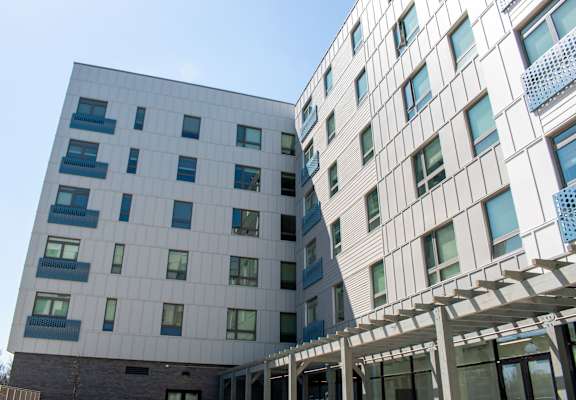 two buildings with a clear blue sky in the background