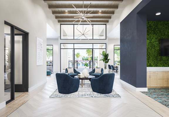 a living room with blue chairs and a table