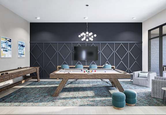 a game room with a pool table and a tv