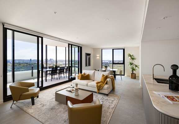 A modern living room with a view of the city.