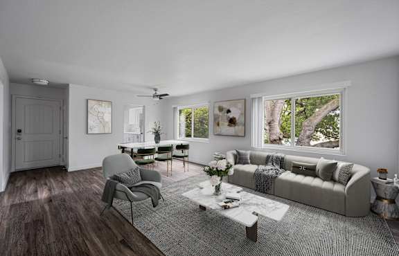 a living room with a couch and a table  and a bedroom at Hillsdale Garden Apartments, CA, 94403