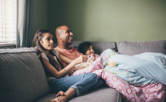 Happy older couple lounging on couch together at The Countryside, Countryside, IL 60525