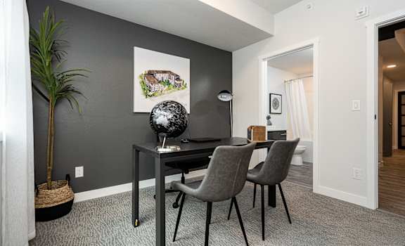 a dining room with a table with chairs and a globe on it
