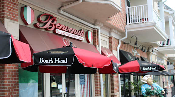 a row of umbrellas in front of a restaurant