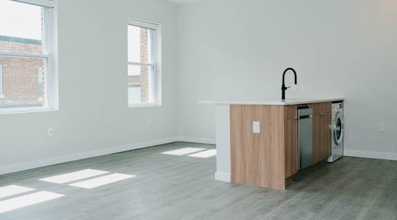 an empty room with an island in the corner of a kitchen at Howard Manor, Washington, DC