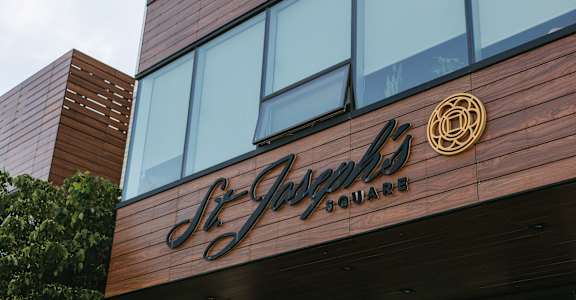 A building with a sign that says St. James Square.